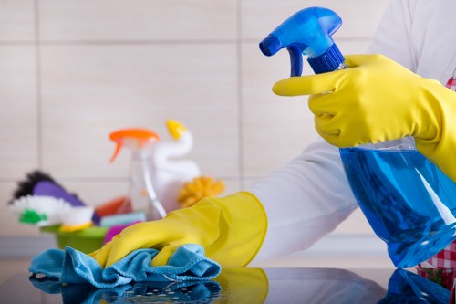 Carpet cleaning technician using safety procedures and protective equipment