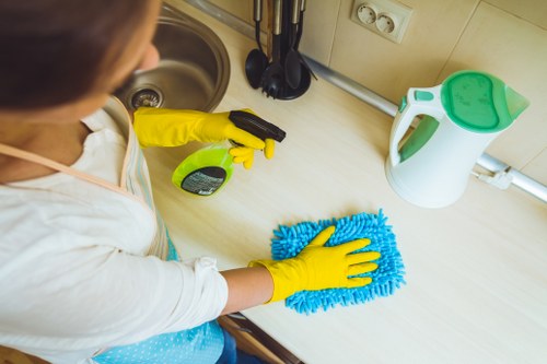 Cleaning staff managing risks and equipment safely